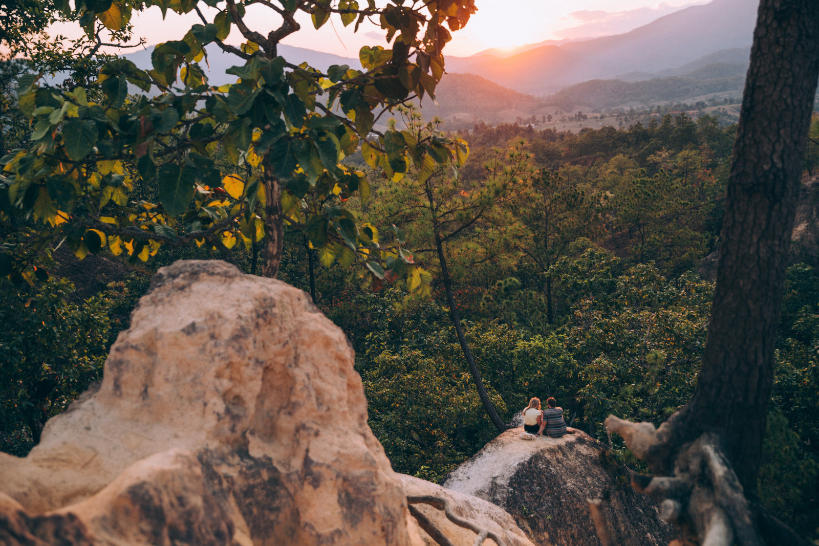 Two people enjoying a sunset view together
